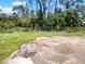 Large backyard with chain link fence and partially cleared area at 790 Harvard St, Englewood, FL 34223