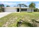 Newly renovated home with a large yard and driveway at 790 Harvard St, Englewood, FL 34223