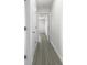 Clean hallway with light walls and wood-look flooring at 790 Harvard St, Englewood, FL 34223