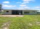 Single story home with large screened porch and grassy yard at 790 Harvard St, Englewood, FL 34223