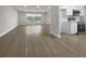 Modern kitchen with white cabinets, quartz countertops and stainless steel appliances at 790 Harvard St, Englewood, FL 34223