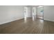 Bright bedroom with wood-look floors and mirrored closet doors at 790 Harvard St, Englewood, FL 34223