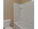 Small bathroom with a white bathtub and tiled shower surround at 12302 Fairlawn Dr, Riverview, FL 33579