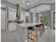 Modern kitchen with white cabinets, stainless steel appliances, and a large island at 82 Fairway Rd, Rotonda West, FL 33947