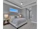 Main bedroom with king-size bed, nightstands and view into the bathroom at 82 Fairway Rd, Rotonda West, FL 33947