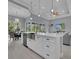 Open concept kitchen with a large island and stainless steel sink at 82 Fairway Rd, Rotonda West, FL 33947