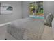 Relaxing bedroom with a queen-size bed and sliding glass doors opening to the pool at 82 Fairway Rd, Rotonda West, FL 33947