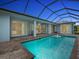 Inviting pool area with covered patio and spacious backyard at 82 Fairway Rd, Rotonda West, FL 33947