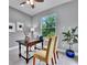 Home office with a large window and a wooden desk at 82 Fairway Rd, Rotonda West, FL 33947