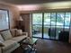 Living room with access to patio at 36750 Us Highway 19 N # 13-216, Palm Harbor, FL 34684