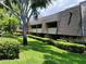 Building exterior with landscaping at 36750 Us Highway 19 N # 13-216, Palm Harbor, FL 34684
