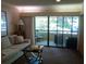 Living room with access to patio at 36750 Us Highway 19 N # 13-216, Palm Harbor, FL 34684