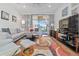 Spacious living room with sectional sofa and large TV at 8231 Dunham Station Dr, Tampa, FL 33647