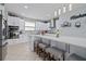 Modern kitchen with white cabinets, quartz countertops, and stainless steel appliances at 8231 Dunham Station Dr, Tampa, FL 33647