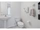 Small bathroom with toilet and pedestal sink at 8231 Dunham Station Dr, Tampa, FL 33647
