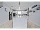 Modern kitchen with white cabinets, quartz countertops, and stainless steel appliances at 8231 Dunham Station Dr, Tampa, FL 33647