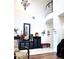 Living room with high ceilings, hardwood floors, and large windows at 8231 Dunham Station Dr, Tampa, FL 33647
