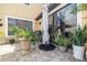 Stone patio with potted plants and a large umbrella at 8231 Dunham Station Dr, Tampa, FL 33647