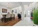 Spacious entryway with high ceilings, hardwood floors, and views into dining area at 8231 Dunham Station Dr, Tampa, FL 33647