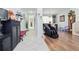 Open living space with hardwood floors and tile entry at 8231 Dunham Station Dr, Tampa, FL 33647