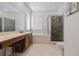 Elegant bathroom with double vanity, soaking tub, and separate shower at 8231 Dunham Station Dr, Tampa, FL 33647