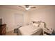 Bedroom with double bed, nightstand, and large window at 10255 Norwick St, Spring Hill, FL 34608