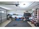 Spacious garage with flooring and overhead storage at 10255 Norwick St, Spring Hill, FL 34608
