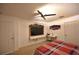 Bedroom with ceiling fan, tv and desk area at 10255 Norwick St, Spring Hill, FL 34608