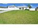 Front view of a single-story house with a two-car garage and a grassy yard at 10255 Norwick St, Spring Hill, FL 34608