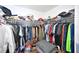 Large walk-in closet with ample hanging space and shelving at 10255 Norwick St, Spring Hill, FL 34608