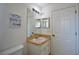 Bathroom features a single sink and linen closet at 10255 Norwick St, Spring Hill, FL 34608