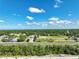 Wide aerial view of neighborhood, roads and surrounding landscape at 10255 Norwick St, Spring Hill, FL 34608