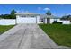 Concrete driveway leading to a two-car garage at 10255 Norwick St, Spring Hill, FL 34608