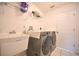 Laundry room with washer, dryer, and utility sink at 10255 Norwick St, Spring Hill, FL 34608