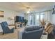 Relaxing living room with water view, featuring comfortable seating and fireplace at 25188 Marion Ave # A103, Punta Gorda, FL 33950