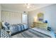 Bright bedroom with twin beds and built-in closet at 25188 Marion Ave # A103, Punta Gorda, FL 33950