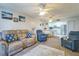 Comfortable living room with open kitchen, and neutral color palette at 25188 Marion Ave # A103, Punta Gorda, FL 33950