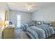 Charming bedroom with twin beds and dresser at 25188 Marion Ave # A103, Punta Gorda, FL 33950