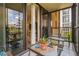 Enclosed patio with glass doors and canal view at 25188 Marion Ave # A103, Punta Gorda, FL 33950