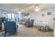 Spacious living area with dining space, comfortable seating, and large windows at 25188 Marion Ave # A103, Punta Gorda, FL 33950