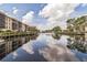 Scenic waterfront property with reflecting canal and boats at 25188 Marion Ave # A103, Punta Gorda, FL 33950