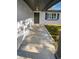 Inviting front porch with tiled flooring and covered entryway at 7901 Rusty Oak Dr, New Port Richey, FL 34653