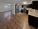 Modern kitchen with dark cabinets and granite counters at 7901 Rusty Oak Dr, New Port Richey, FL 34653