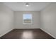 Bedroom with a window and dark tile flooring at 8064 Olive Brook Dr, Wesley Chapel, FL 33545