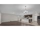 Open kitchen with island and dark wood cabinets at 8064 Olive Brook Dr, Wesley Chapel, FL 33545