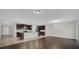 Open kitchen with dark cabinets and an island at 8064 Olive Brook Dr, Wesley Chapel, FL 33545