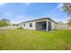 Large backyard with screened patio and pond view at 8064 Olive Brook Dr, Wesley Chapel, FL 33545