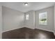 Bright bedroom with dark tile flooring and a window at 8064 Olive Brook Dr, Wesley Chapel, FL 33545