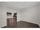 Dining room with dark wood floors and view of kitchen at 8064 Olive Brook Dr, Wesley Chapel, FL 33545