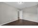 Bedroom with door to hallway and dark tile flooring at 8064 Olive Brook Dr, Wesley Chapel, FL 33545